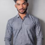 man wearing long sleeve grey with stripes button-down shirt