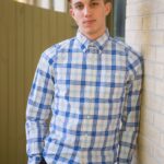 man wearing long sleeve button-down shirt with blue and white stripes